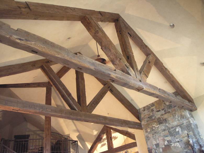 Hand-Hewn Timbers and Trusses / These hand-hewn timbers were stained by the contractor before installation